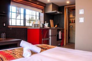 Säng eller sängar i ett rum på Penke Panke Lodge and Apartments