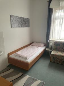 מיטה או מיטות בחדר ב-Altes Brauhaus