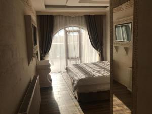 Una cama o camas en una habitación de Midyat GAP Hotel