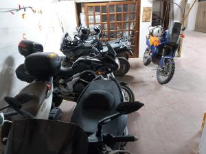 motorcycles are parked in a garage at Blu&Blu in Alghero