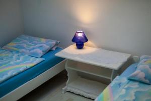 Postel nebo postele na pokoji v ubytování Apartments Katarina B