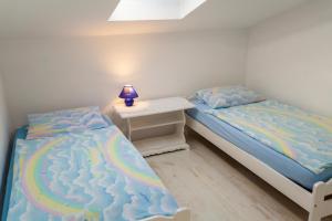 Postel nebo postele na pokoji v ubytování Apartments Katarina B