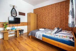 Posteľ alebo postele v izbe v ubytovaní Apartamenty w Centrum - Zakopane