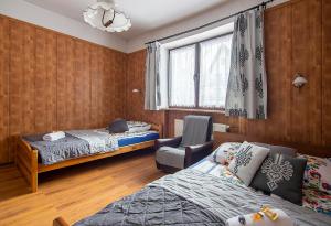 Tempat tidur dalam kamar di Apartamenty w Centrum - Zakopane