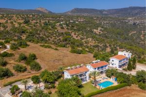 an aerial view of a house with a swimming pool at Socrates Apartments in Polis Chrysochous