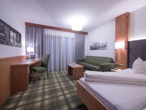 Letto o letti in una camera di Hotel Alphof Alpbach
