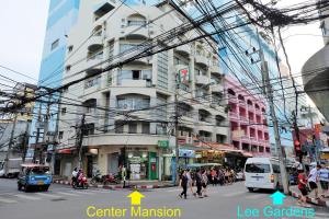 a busy city street with a lot of wires and buildings at Center Mansion at Hatyai in Hat Yai