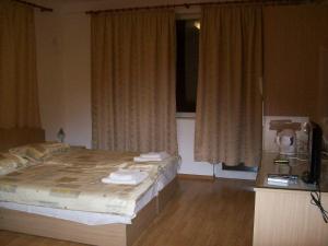 Ένα ή περισσότερα κρεβάτια σε δωμάτιο στο Guest House Donchevi
