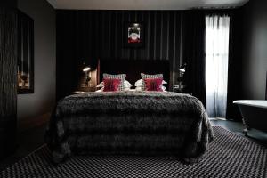 A bed or beds in a room at Malmaison Dundee 