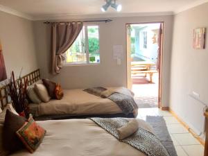 Postel nebo postele na pokoji v ubytování Keedols Inn & Backpackers