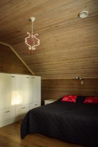 Posteľ alebo postele v izbe v ubytovaní Loma-Autio Tähti Villa