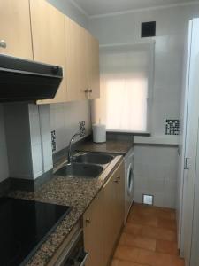 Kuchyň nebo kuchyňský kout v ubytování Apartamento Casalmar