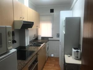 Kuchyň nebo kuchyňský kout v ubytování Apartamento Casalmar