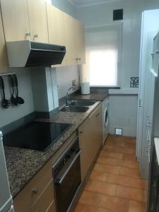 Kuchyň nebo kuchyňský kout v ubytování Apartamento Casalmar