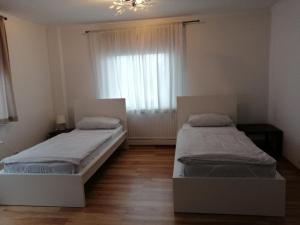 Apartment AMS tesisinde bir odada yatak veya yataklar