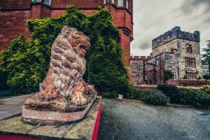 a statue of a bear sitting on top of a building at Ruthin Castle Hotel and Spa in Ruthin