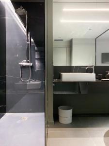 a bathroom with a sink and a bath tub at Bv hotel in Brignano Gera dʼAdda