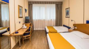 Postel nebo postele na pokoji v ubytování Hotel Express Aosta East
