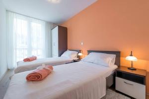 Postel nebo postele na pokoji v ubytování Apartment Magnolia