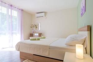 Postel nebo postele na pokoji v ubytování Apartment Magnolia