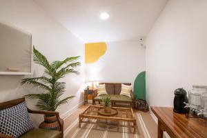 a living room with a couch and a table at Belle Époque Self-check-in Guesthouse - Adults-Only in San Sebastián