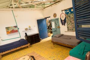 Una cama o camas en una habitación de Hostal La Mariapolis