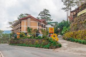 a building on the side of a road at South Drive Baguio Manor in Baguio