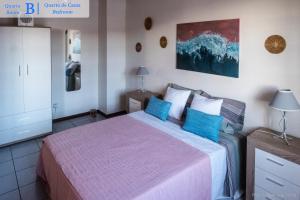 מיטה או מיטות בחדר ב-Casa dos Guerra