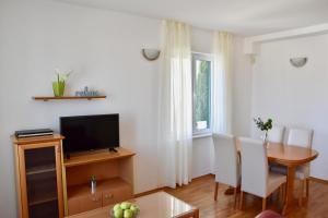 
A television and/or entertainment center at Pervanovo Apartments with Free Parking
