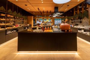 a restaurant with a counter with a pumpkin on it at Sackmann Schwarzwald Charme in Baiersbronn