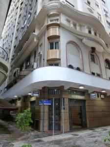 a building with a sign in front of it at Itajubá Hotel in Rio de Janeiro