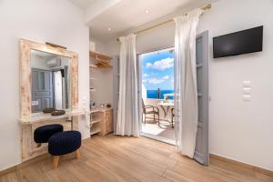 a living room with a view of the ocean at Hotel Thira in Fira