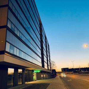 a large building with a street in front of it at Warsaw Inside Business Centre in Warsaw