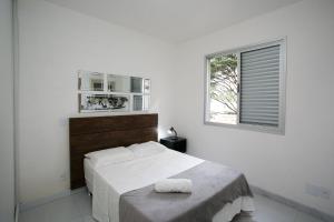 Een bed of bedden in een kamer bij Locking´s Grajaú 3