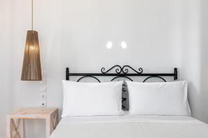 Ένα ή περισσότερα κρεβάτια σε δωμάτιο στο Hotel Thira