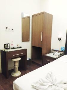 Postel nebo postele na pokoji v ubytování Omah Qu Guesthouse Malioboro