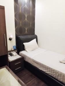 Postel nebo postele na pokoji v ubytování Omah Qu Guesthouse Malioboro