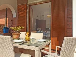 a table and chairs on a patio at Villa Marcella by Interhome in Forte dei Marmi