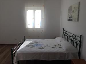 Een bed of bedden in een kamer bij Casa vacanza VIMA