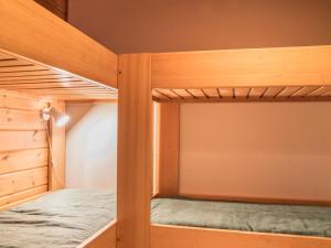 a couple of bunk beds in a room at Holiday Home Lomaylläs h109 -pistopolku 1 a by Interhome in Ylläsjärvi +9 photos