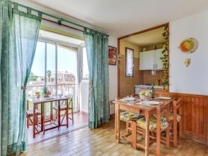a kitchen and dining room with a table at Apartment Plein Soleil-1 by Interhome in Cap d'Agde
