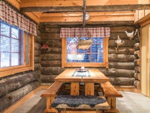 a wooden table in a room in a log cabin at Holiday Home Operonmukka a 8 by Interhome in Levi
