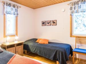 Postel nebo postele na pokoji v ubytování Holiday Home Aamutähti by Interhome