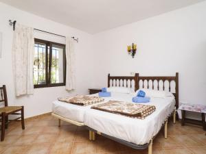 A bed or beds in a room at Holiday Home Pedro by Interhome