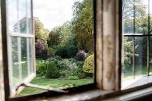a view of a garden from a window at The South Wing in Salisbury