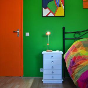 a bedroom with a bed and a lamp at Harry's Home Tiel Bed & Breakfast in Tiel