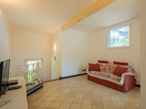 a living room with a couch and a window at Apartment Casa del Leone II by Interhome in Rapallo