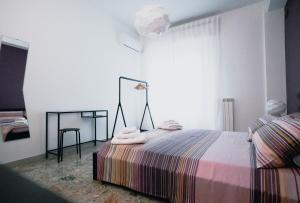 Posteľ alebo postele v izbe v ubytovaní La Casa Di Adua