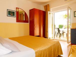 En eller flere senge i et værelse på Apartment Ana-1 by Interhome