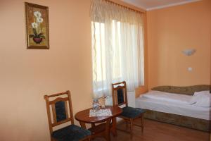 Łóżko lub łóżka w pokoju w obiekcie Hotel Czardasz